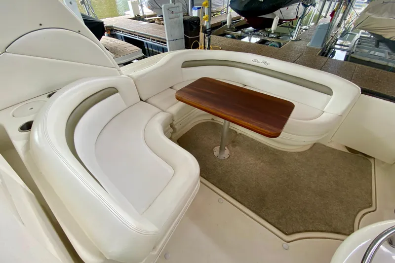  Yacht Photos Pics Luxurious seating area on 2007 Sea Ray 340 Sundancer yacht with wooden table.