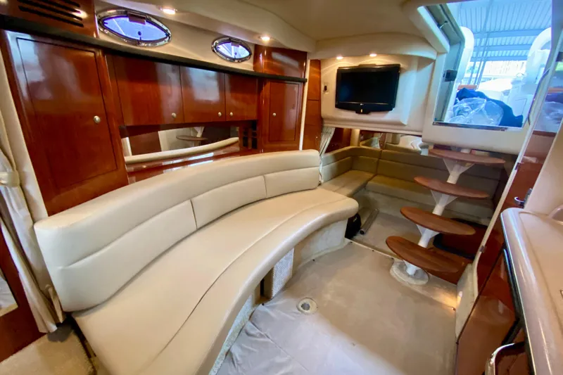  Yacht Photos Pics Luxurious interior of 2007 Sea Ray 340 Sundancer yacht with plush seating and wooden accents.
