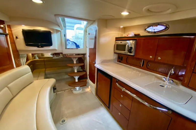  Yacht Photos Pics Luxurious interior of 2007 Sea Ray 340 Sundancer yacht with kitchen and seating area.