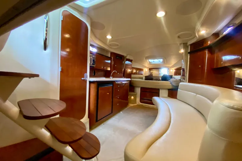  Yacht Photos Pics Luxurious interior of 2007 Sea Ray 340 Sundancer yacht with elegant wood finishes.