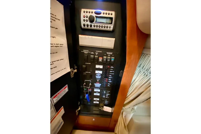  Yacht Photos Pics Electrical panel inside 2007 Sea Ray 340 Sundancer boat, featuring control switches and stereo system.