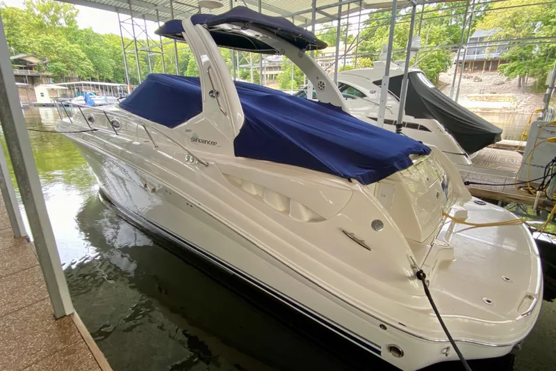  Yacht Photos Pics 2007 Sea Ray 340 Sundancer yacht docked with blue cover in marina.