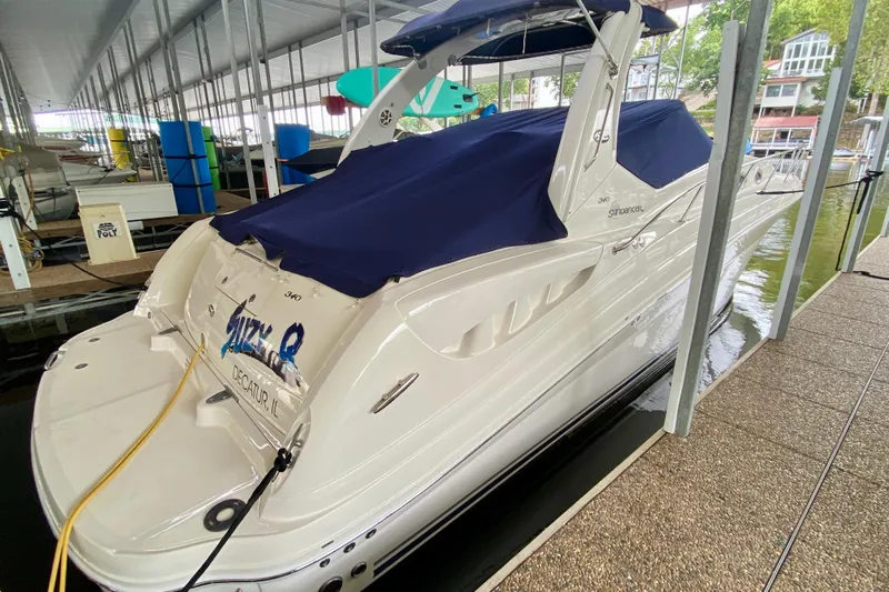  Yacht Photos Pics 2007 Sea Ray 340 Sundancer docked with blue cover in marina.