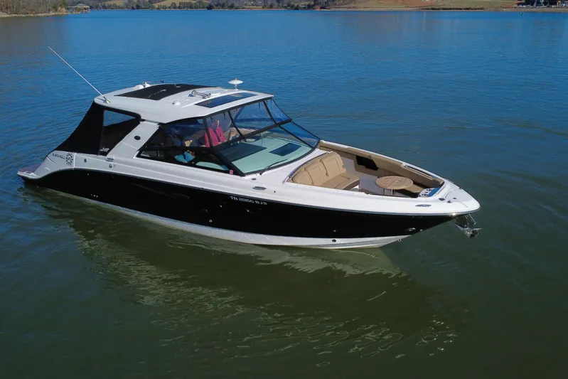  Yacht Photos Pics 2022 Sea Ray SLX 400 boat on calm water, featuring sleek design and spacious seating.