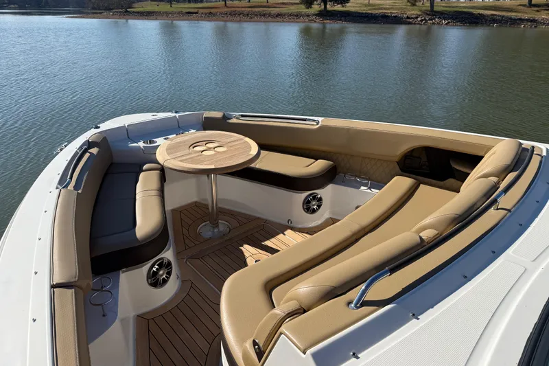  Yacht Photos Pics Luxurious 2022 Sea Ray SLX 400 boat interior with elegant seating and table on water.