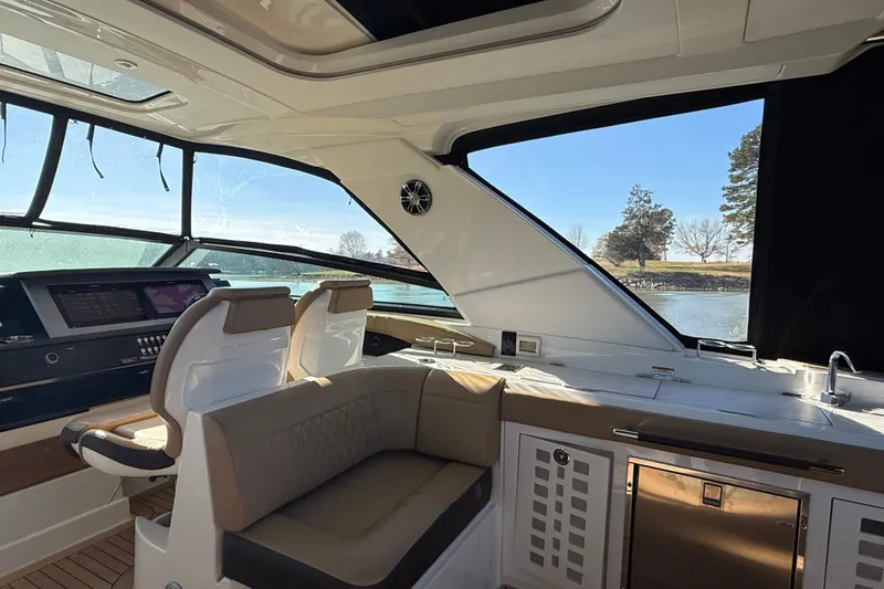  Yacht Photos Pics Interior of 2022 Sea Ray SLX 400 yacht with luxurious seating and modern dashboard.