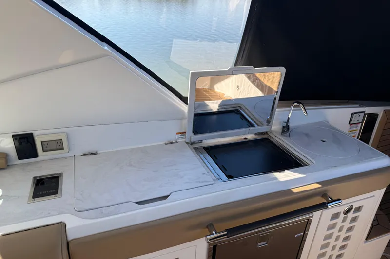  Yacht Photos Pics Outdoor kitchen on 2022 Sea Ray SLX 400 yacht with grill and sink.
