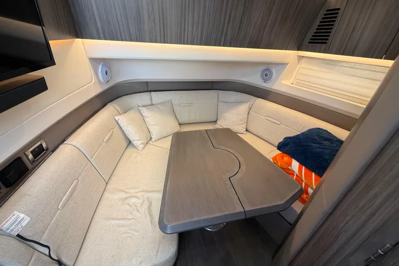  Yacht Photos Pics Luxurious 2022 Sea Ray SLX 400 cabin interior with cozy seating and modern design.