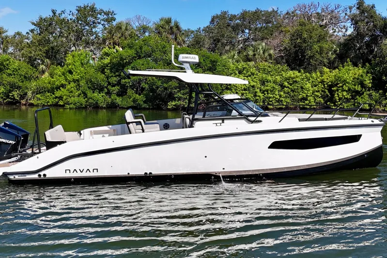  Yacht Photos Pics 2026 Navan S30 boat cruising on a serene waterway with lush greenery.