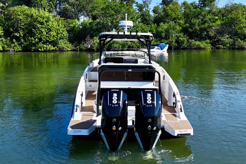  Yacht Photos Pics 2026 Navan S30 boat with dual 300 V8 engines on a serene waterway.