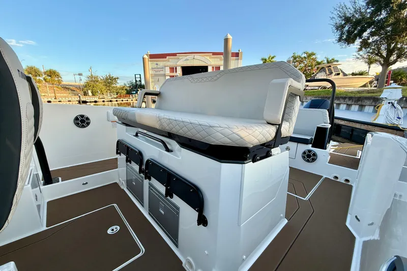  Yacht Photos Pics 2026 Navan S30 boat interior with cushioned seating and storage compartments.