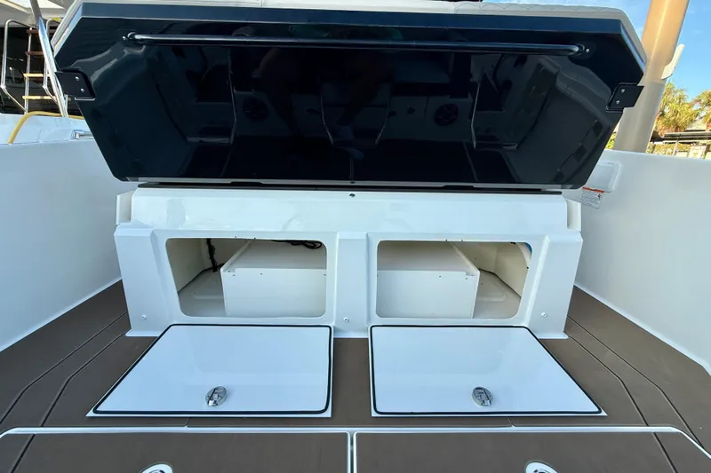  Yacht Photos Pics Navan S30 2026 boat storage compartments with open lids, showcasing interior space.
