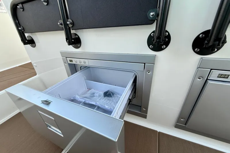  Yacht Photos Pics Navan S30 2026 boat interior with open storage compartment and modern design.