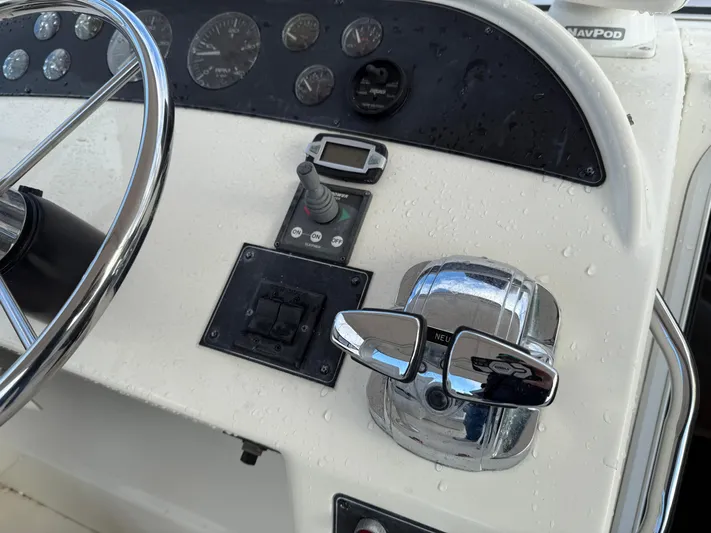  Yacht Photos Pics 2003 Meridian 490 Pilothouse helm with steering wheel and control panel.