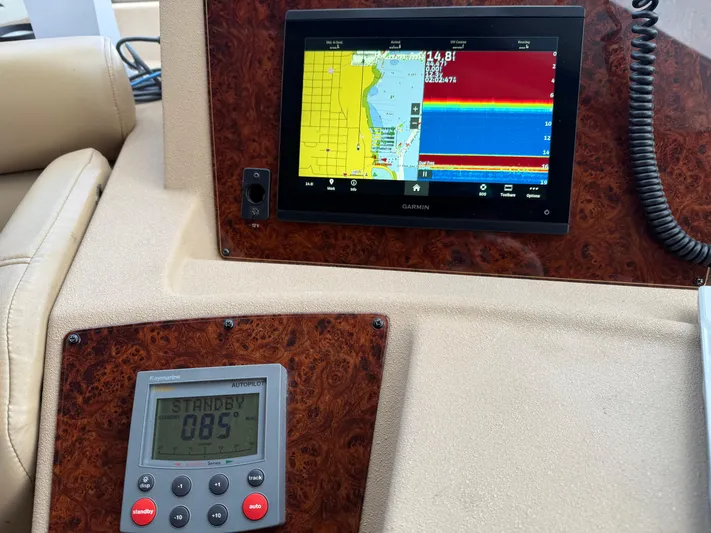  Yacht Photos Pics Control panel of 2003 Meridian 490 Pilothouse with navigation and autopilot displays.