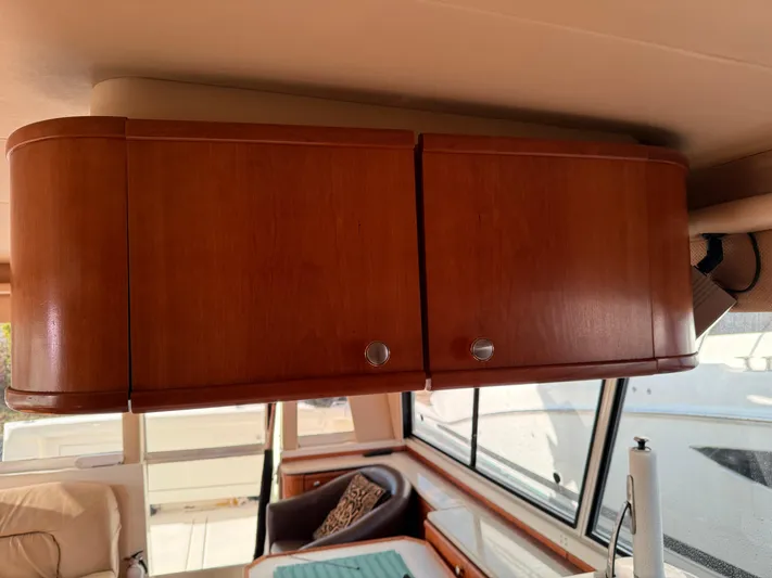  Yacht Photos Pics Wooden cabinets inside a 2003 Meridian 490 Pilothouse yacht interior.