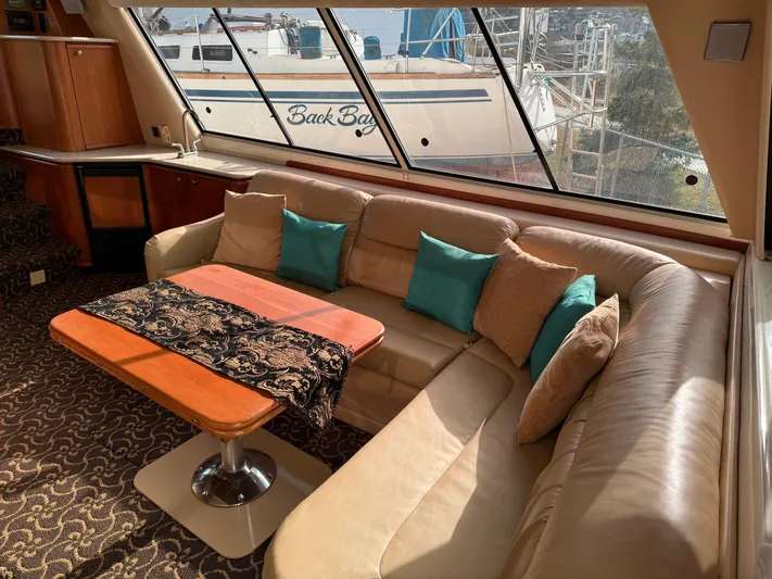  Yacht Photos Pics Luxurious interior of 2003 Meridian 490 Pilothouse with plush seating and elegant decor.