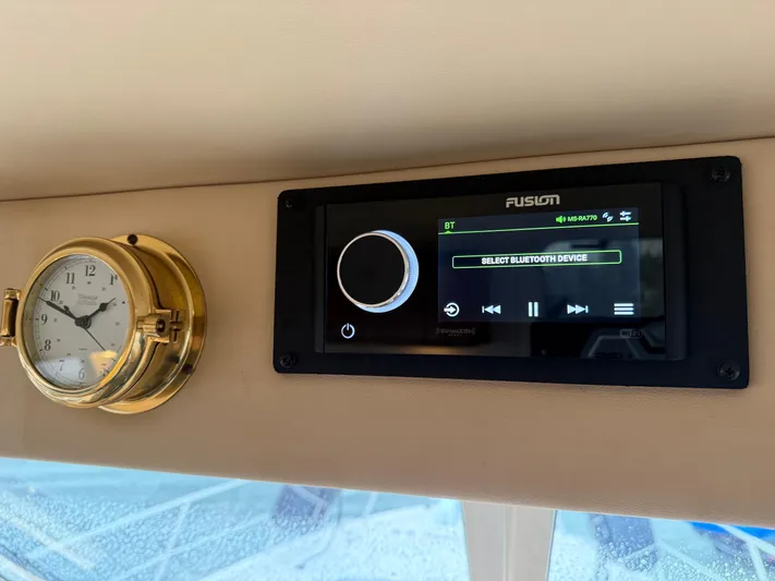  Yacht Photos Pics Fusion stereo and clock on 2003 Meridian 490 Pilothouse dashboard.