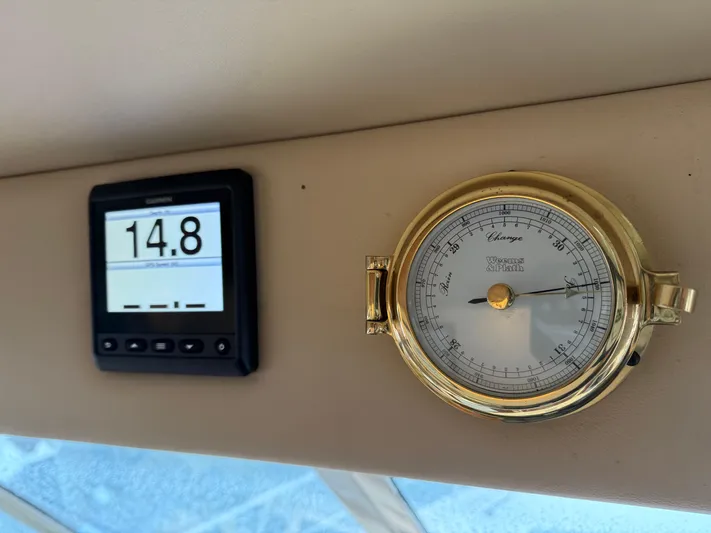  Yacht Photos Pics Digital display and barometer on 2003 Meridian 490 Pilothouse yacht dashboard.