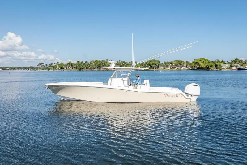  Yacht Photos Pics 2013 Invincible 36 boat on calm water with clear blue sky.