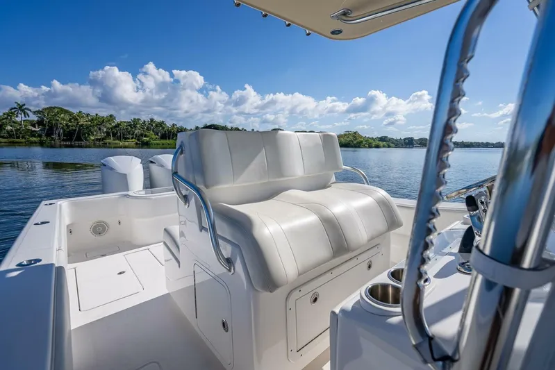  Yacht Photos Pics 2013 Invincible 36 boat interior with white seating, scenic water view.