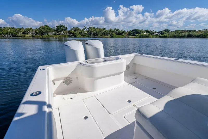  Yacht Photos Pics Invincible 36 boat, 2013 model, with spacious deck and dual engines on a serene lake.