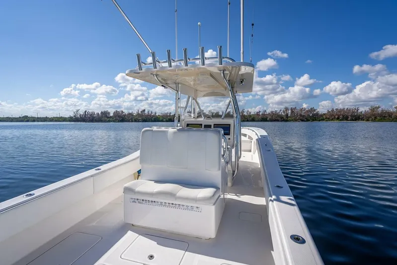  Yacht Photos Pics 2013 Invincible 36 boat on calm water under blue sky.