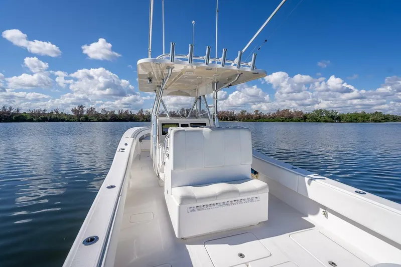  Yacht Photos Pics 2013 Invincible 36 boat on calm water under a clear blue sky.
