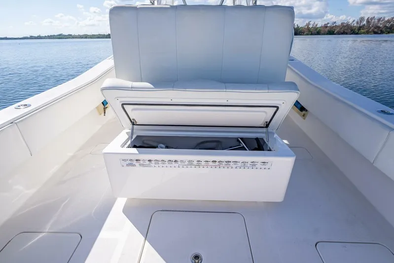  Yacht Photos Pics Open storage compartment on 2013 Invincible 36 boat, with scenic water view.