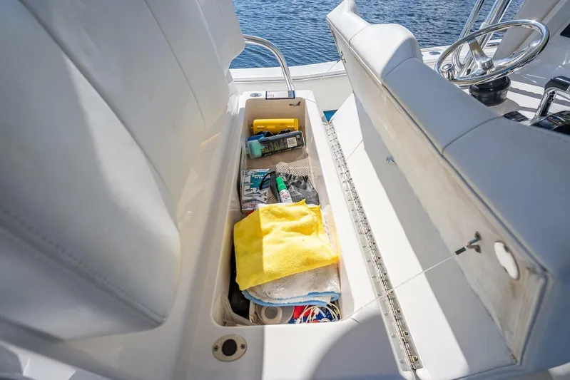  Yacht Photos Pics Storage compartment on 2013 Invincible 36 boat with cleaning supplies and tools.