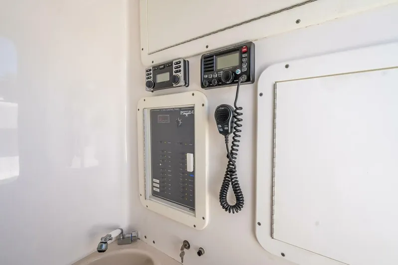  Yacht Photos Pics Control panel and radio equipment inside a 2013 Invincible 36 boat.