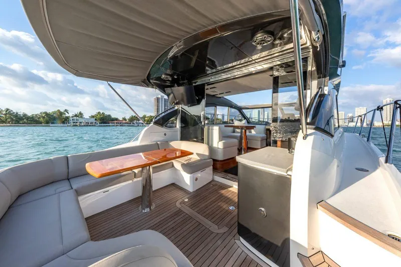 Presumed Innocent Yacht Photos Pics Luxurious 2017 Princess V48 Open yacht interior with elegant seating and wooden accents.