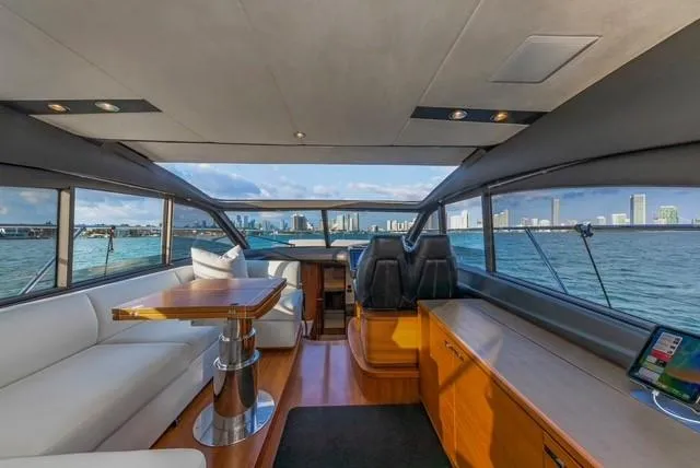 Presumed Innocent Yacht Photos Pics Interior of 2017 Princess V48 Open yacht with city skyline view.