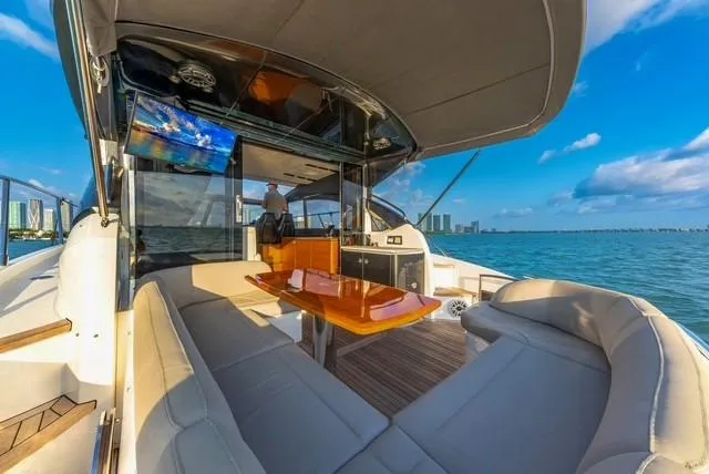 Presumed Innocent Yacht Photos Pics Luxurious 2017 Princess V48 Open yacht interior with ocean view and modern seating.