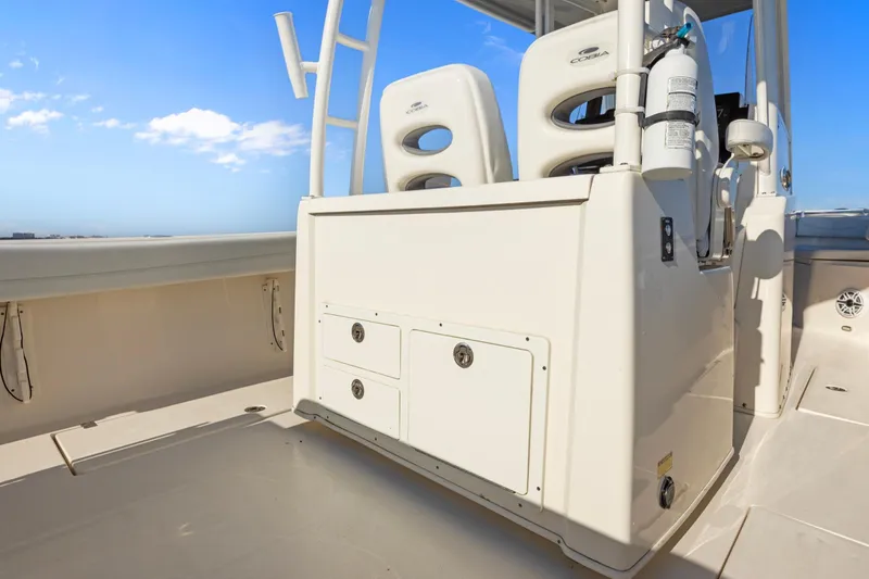  Yacht Photos Pics 2023 Cobia 301 Center Console boat interior with seating and storage compartments.