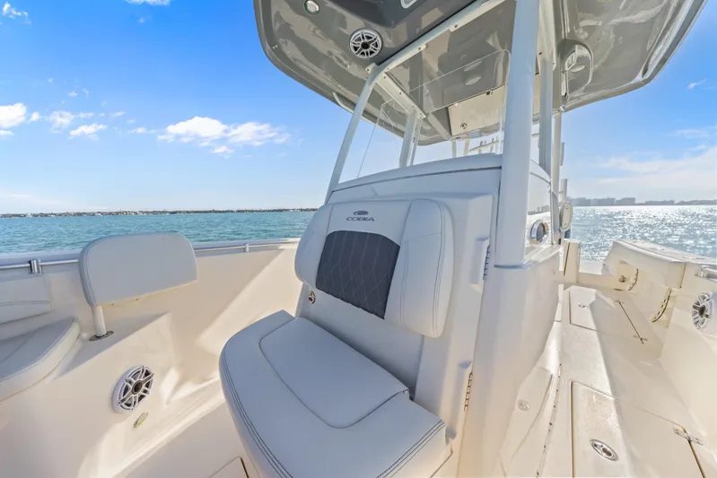  Yacht Photos Pics 2023 Cobia 301 Center Console boat interior with ocean view and clear blue sky.