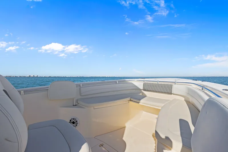  Yacht Photos Pics 2023 Cobia 301 Center Console boat interior with ocean view and clear blue sky.