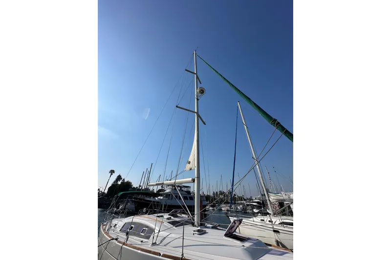 Shamrock Yacht Photos Pics Sailboat Beneteau Oceanis 40, 2011 model, docked under clear blue sky.