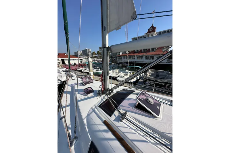 Shamrock Yacht Photos Pics 2011 Beneteau Oceanis 40 sailboat docked at marina, showcasing deck and rigging.