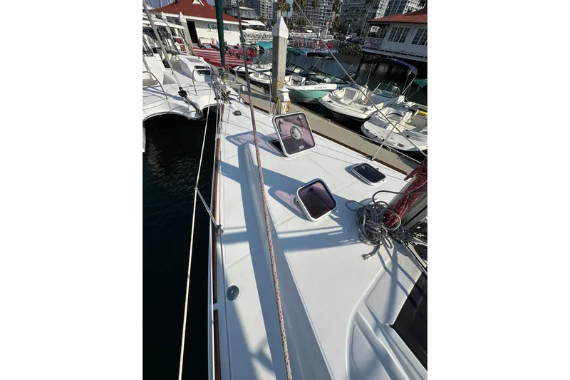 Shamrock Yacht Photos Pics 2011 Beneteau Oceanis 40 sailboat deck view at marina, showcasing hatches and rigging.