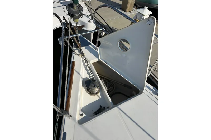 Shamrock Yacht Photos Pics Open anchor locker on 2011 Beneteau Oceanis 40 sailboat, showing chain and winch.