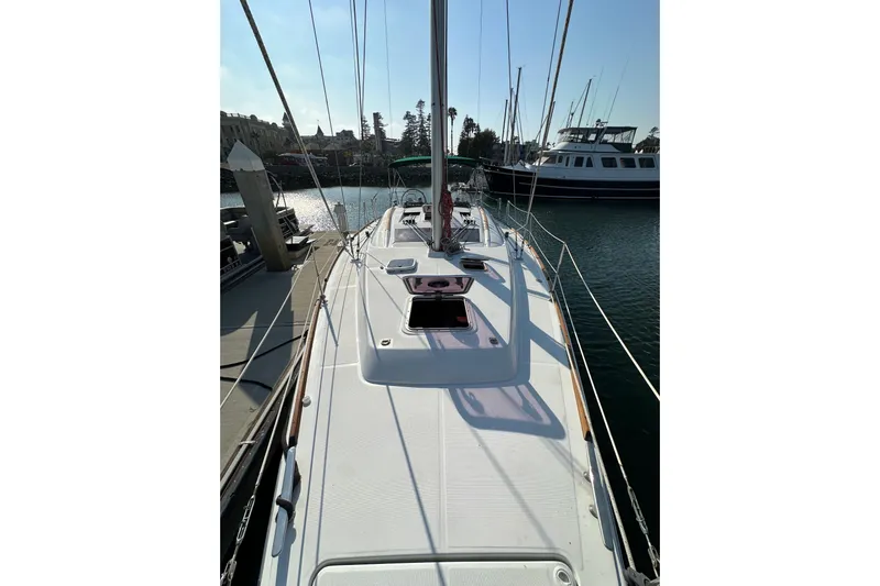 Shamrock Yacht Photos Pics 2011 Beneteau Oceanis 40 sailboat docked at marina, sunny day.