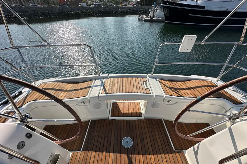 Shamrock Yacht Photos Pics 2011 Beneteau Oceanis 40 yacht cockpit with dual steering wheels and teak flooring.