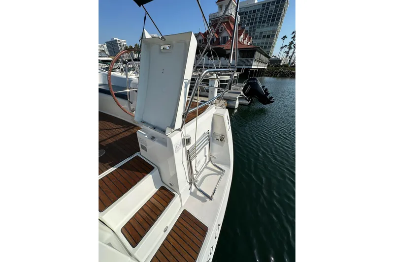 Shamrock Yacht Photos Pics Beneteau Oceanis 40 sailboat, 2011 model, docked with open swim platform and wooden deck.