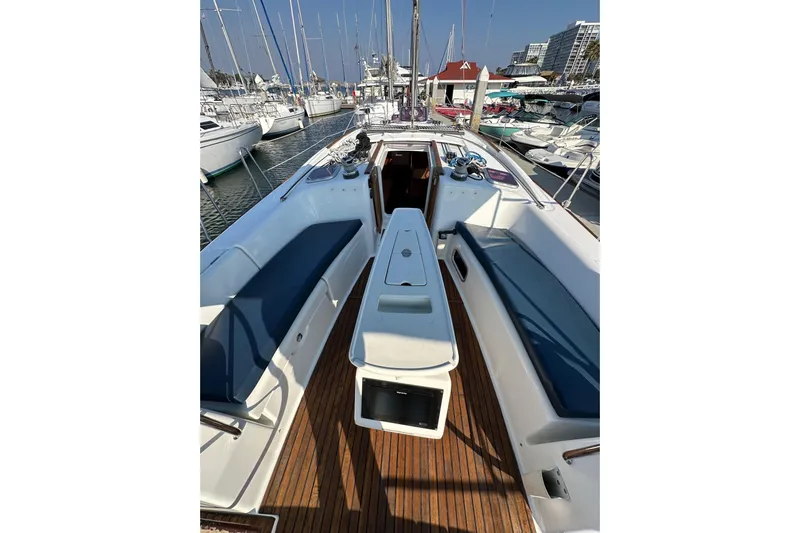 Shamrock Yacht Photos Pics Beneteau Oceanis 40 sailboat cockpit, 2011 model, docked in a marina with other boats.