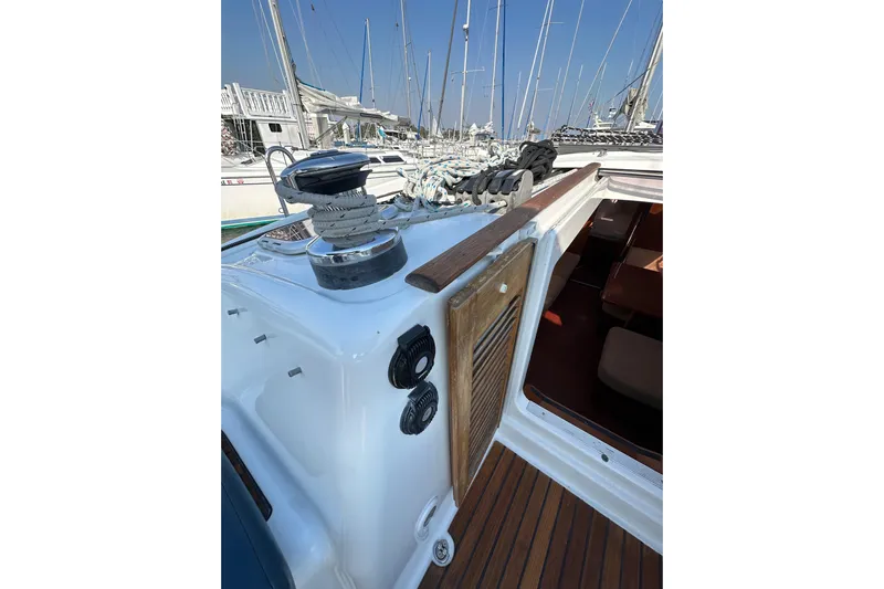 Shamrock Yacht Photos Pics Beneteau Oceanis 40 sailboat deck, 2011 model, featuring winch and cabin entrance.