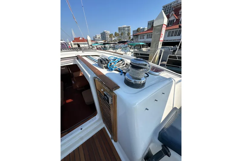 Shamrock Yacht Photos Pics Beneteau Oceanis 40 sailboat deck with winch and ropes, docked at marina, 2011 model.