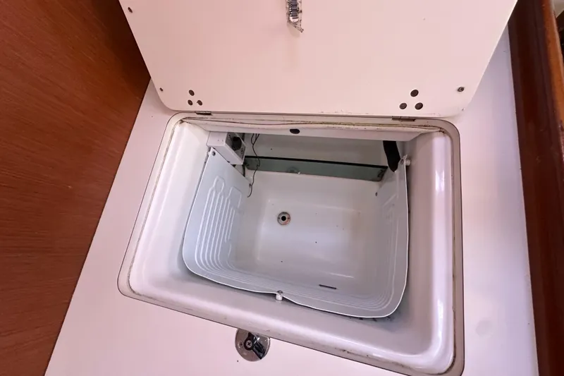 Shamrock Yacht Photos Pics Open storage compartment on 2011 Beneteau Oceanis 40 sailboat interior.