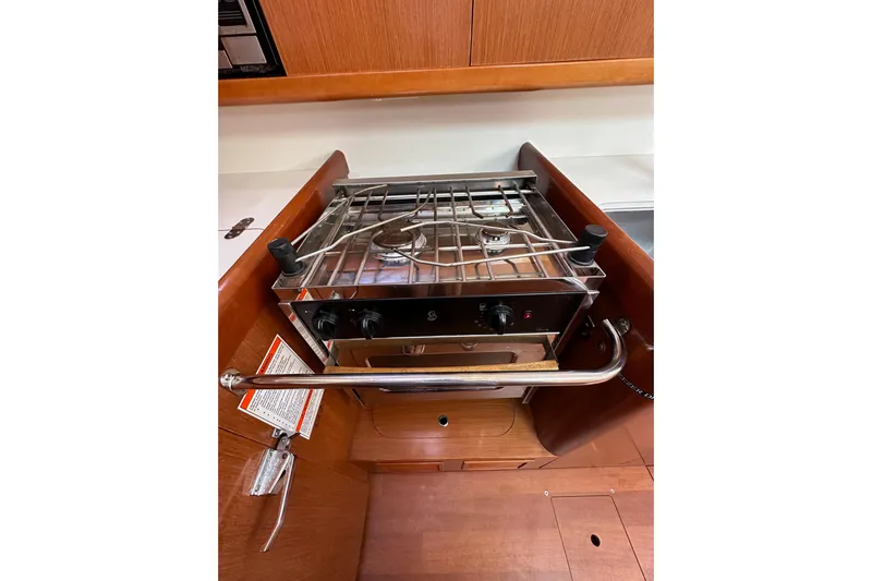 Shamrock Yacht Photos Pics Galley stove in 2011 Beneteau Oceanis 40 yacht, featuring a compact design.