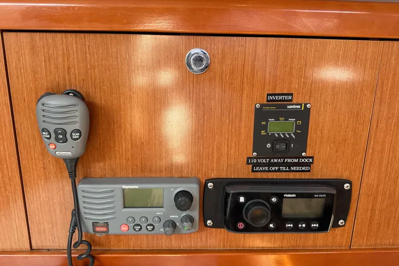 Shamrock Yacht Photos Pics Control panel of a 2011 Beneteau Oceanis 40 sailboat with radio and inverter.